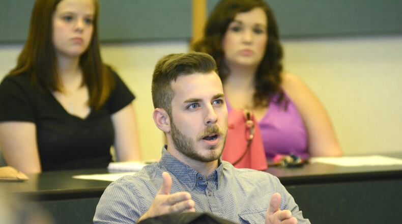 Matt Fox, a Miami University junior, asks a question to candidates for the Nov. 8 general election speak about volunteer opportunities and the issues the state and local communities face during the Civic Fair at the Miami University Hamilton campus on Monday, Sept. 12, 2016. The event was part of the university’s Citizenship and Democracy Week at its regional and main campuses. MICHAEL D. PITMAN/STAFF