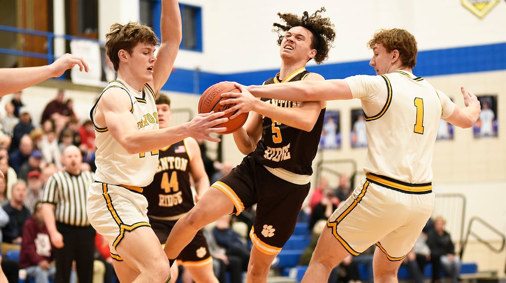 Kenton Ridge senior Xavier White attempts to split the defense during their Division IV second round game against Oakwood on Saturday, Feb. 28, 2026 at Xenia High School. The Lumberjacks won 75-68. GEOFF NEVILLE / CONTRIBUTED PHOTO