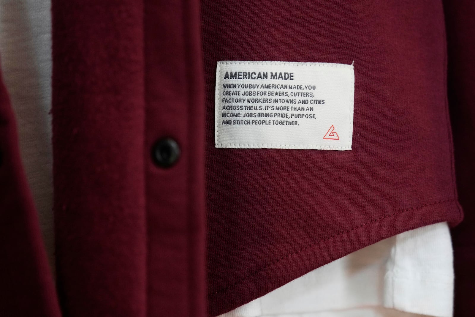 An American Giant tag is shown on clothing at the company's showroom in San Francisco, Thursday, April 17, 2025. (AP Photo/Jeff Chiu)
