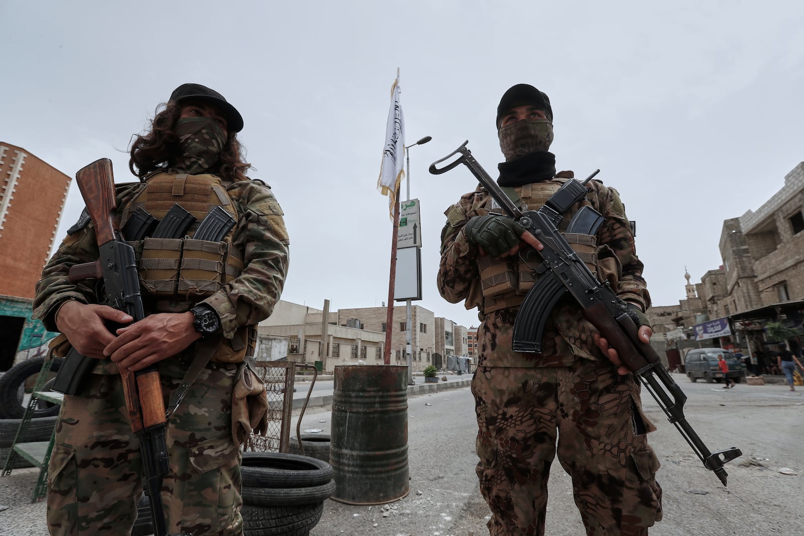 Syrian government security forces stand guard on their checkpointat one of Jaramana suburb entrances, after clashes in the area between members of the minority Druze sect and pro-government fighters, in the southern suburb of Jaramana, Damascus, Syria, Wednesday, April 30, 2025. (AP Photo/Omar Sanadiki)