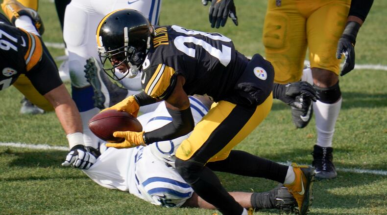 Pittsburgh Steelers cornerback Mike Hilton (28) recovers a fumble in front of Indianapolis Colts offensive tackle Chaz Green (75) during the first half of an NFL football game, Sunday, Dec. 27, 2020, in Pittsburgh. (AP Photo/Gene J. Puskar)