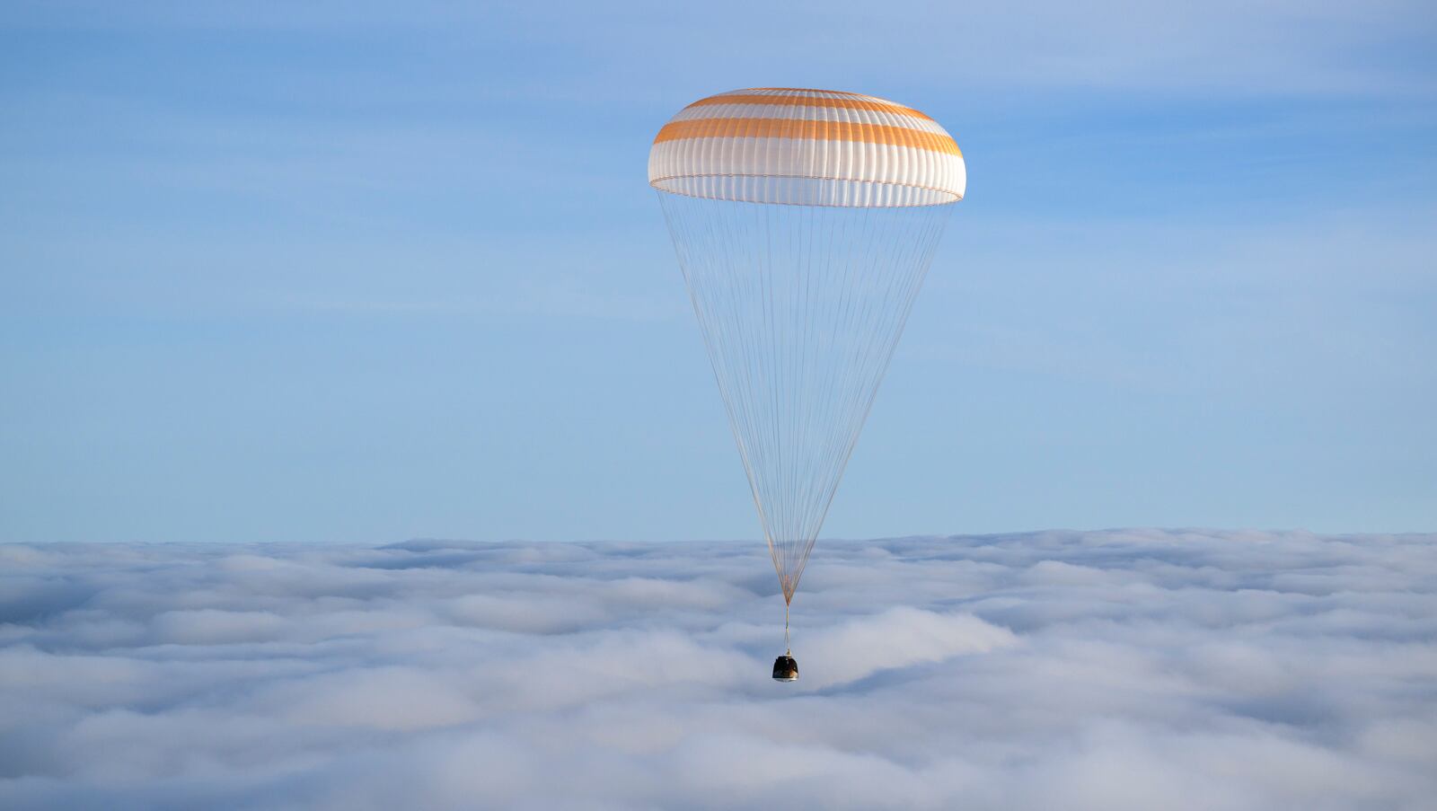 The Soyuz MS-26 spacecraft is seen as it lands in a remote area near the town of Zhezkazgan, Kazakhstan, with NASA astronaut Don Pettit and Roscosmos cosmonauts Alexey Ovchinin and Ivan Vagner aboard, Sunday, April 20, 2025. (Bill Ingalls/NASA via AP)