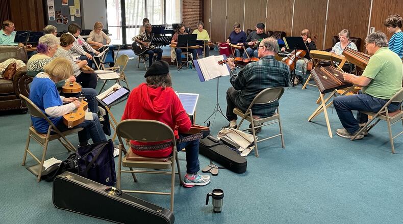 Musicians with other instruments, including guitar, mandolin, fiddle and cello, join in with dulcimer players at a meeting of the Springfield Dulcimer Club. CONTRIBUTED
