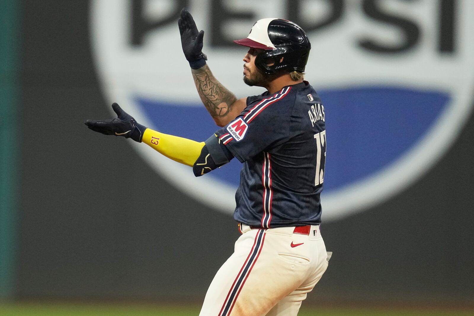Cleveland Guardians' Gabriel Arias gestures from second base after hitting a double in the seventh inning of a baseball game against the Houston Astros in Cleveland, Friday, June 6, 2025. (AP Photo/Sue Ogrocki)
