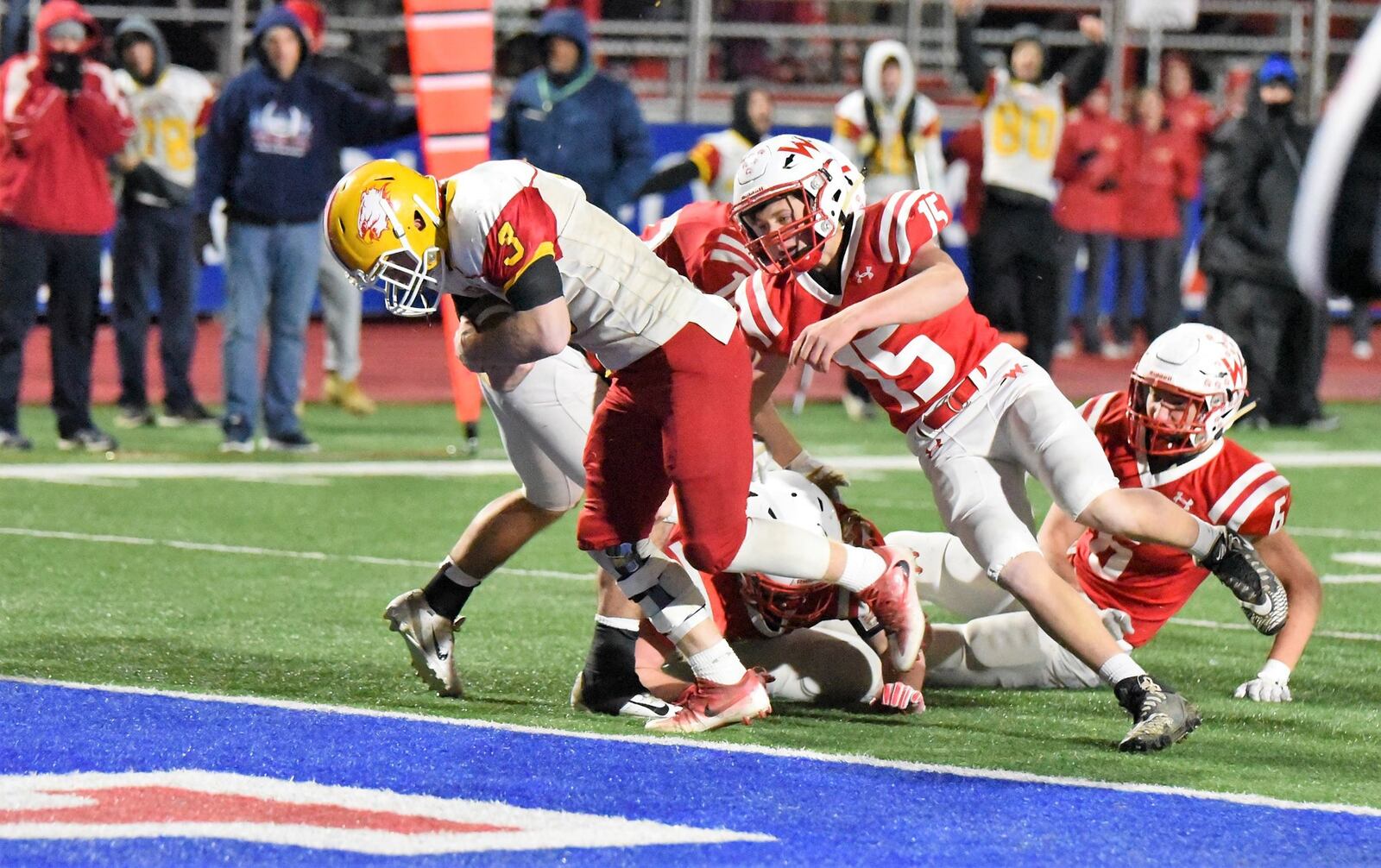 Fenwick’s Jack Fessler (3) gets past Wapakoneta’s Devin Huelskamp (15) for his first touchdown Friday night during a Division III, Region 12 playoff semifinal at Piqua’s Purk Field at Alexander Stadium. CONTRIBUTED PHOTO BY ANGIE MOHRHAUS