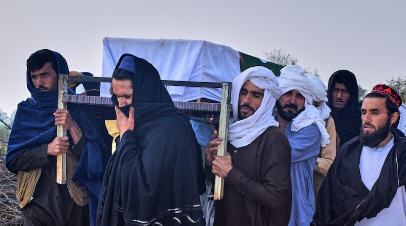People carry the coffin of an army soldier, killed in the cross-border clashes of Pakistan and Afghan forces, for his funeral prayer at a village in Lakki Marwat, a district of Pakistan's Khyber Pakhtunkhwa province, Saturday, Feb. 28, 2026. (AP Photo/G.A. Marwat)