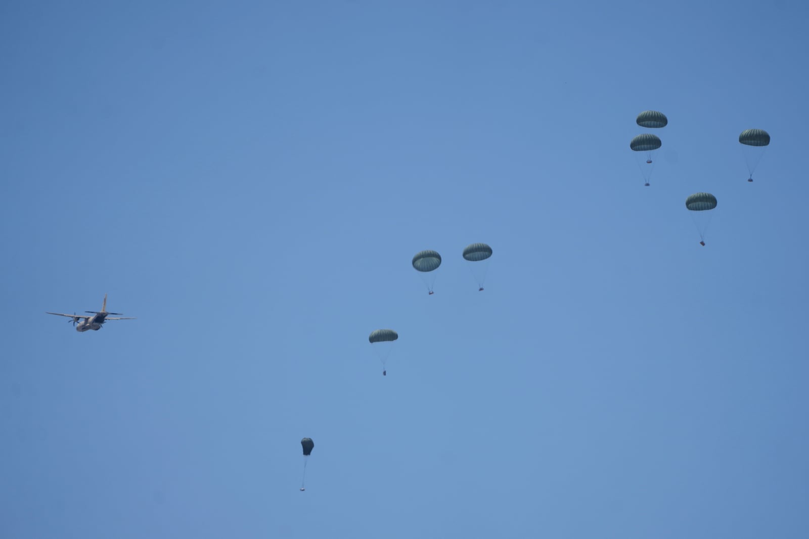Humanitarian aid is airdropped to Palestinians over Deir al-Balah, central Gaza Strip Wednesday, July 30, 2025. (AP Photo/Abdel Kareem Hana)