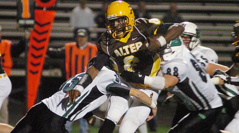 Alter’s quarter back Malik Zaire (6) rushing through Badin’s defensive line at Centerville’s football stadium Friday evening. Contributed Photo by Charles Caperton