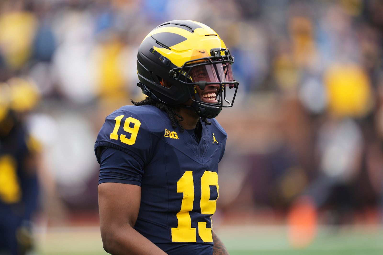 Michigan quarterback Bryce Underwood smiles during an NCAA college football spring game in Ann Arbor, Mich., Saturday, April 19, 2025. (AP Photo/Paul Sancya)