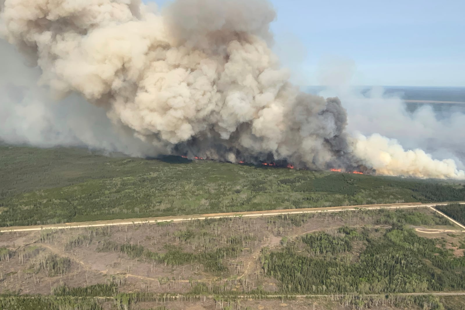 This photo provided by the Manitoba government shows wildfires in Wanless, Manitoba, Canada, on Tuesday, May 27, 2025. (Manitoba government via AP)