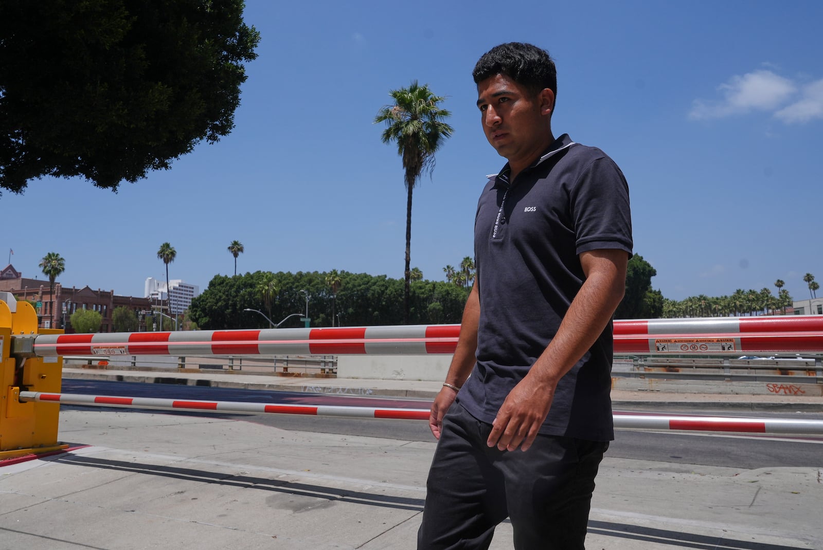 Alejandro Barranco arrives at the Metropolitan Detention Center to check on his father Narciso, who was recently detained by federal agents, on Monday, June 23, 2025, in Los Angeles. (AP Photo/Damian Dovarganes)