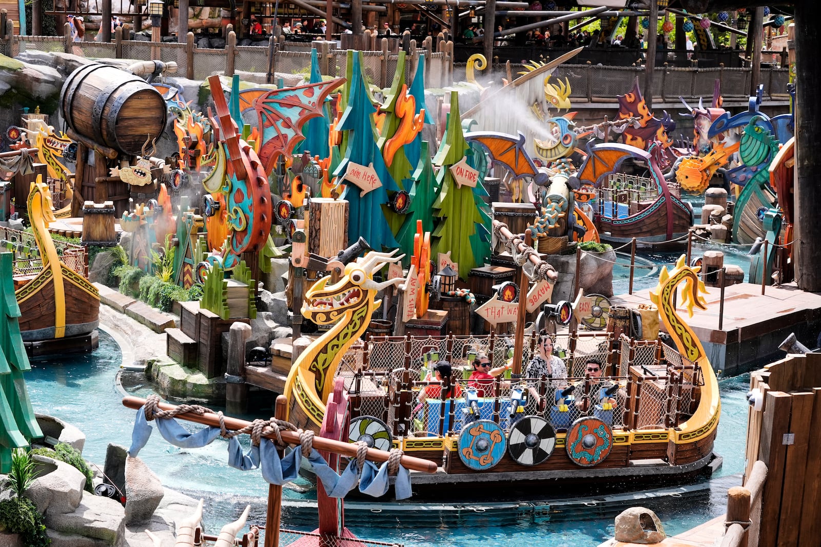 Park guests ride the Fyre Drill boat ride at How to Train Your Dragon – Isle of Berk at Epic Universe Theme Park at Universal Resort Orlando Thursday, April 10, 2025, in Orlando, Fla. (AP Photo/John Raoux)