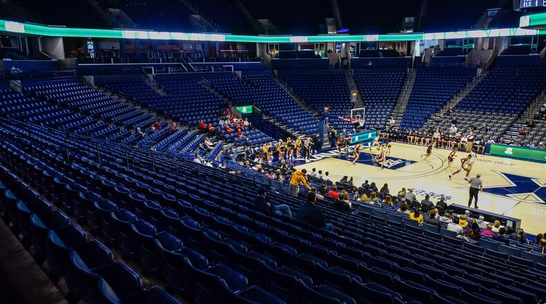 Centerville and Archbishop Moeller boys basketball teams tip off in their Division I semifinal game Wednesday, March 11, 2020 at Xavier University’s Cintas Center. The stands are a lot less crowded than they were for the previous round over the weekend. In an effort to reduce the risk of spreading coronavirus, spectators were limited. NICK GRAHAM / STAFF