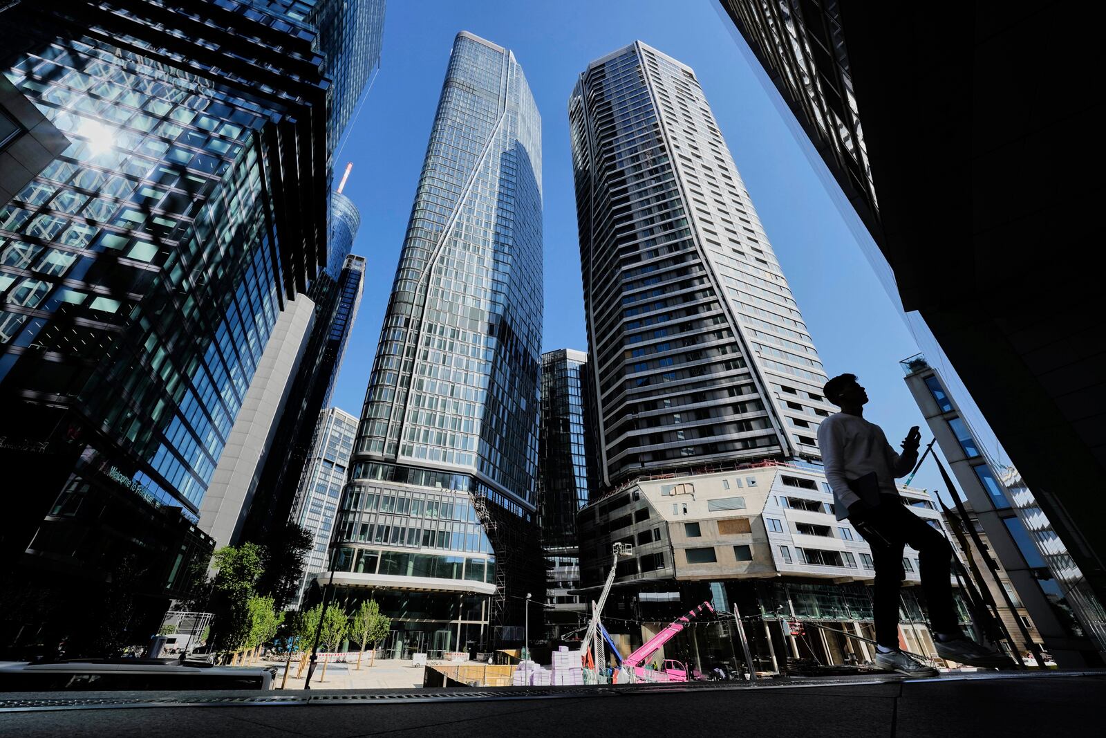 A man walks up to the entrance of a bank in Frankfurt, Germany, Monday, May 19, 2025. (AP Photo/Michael Probst)