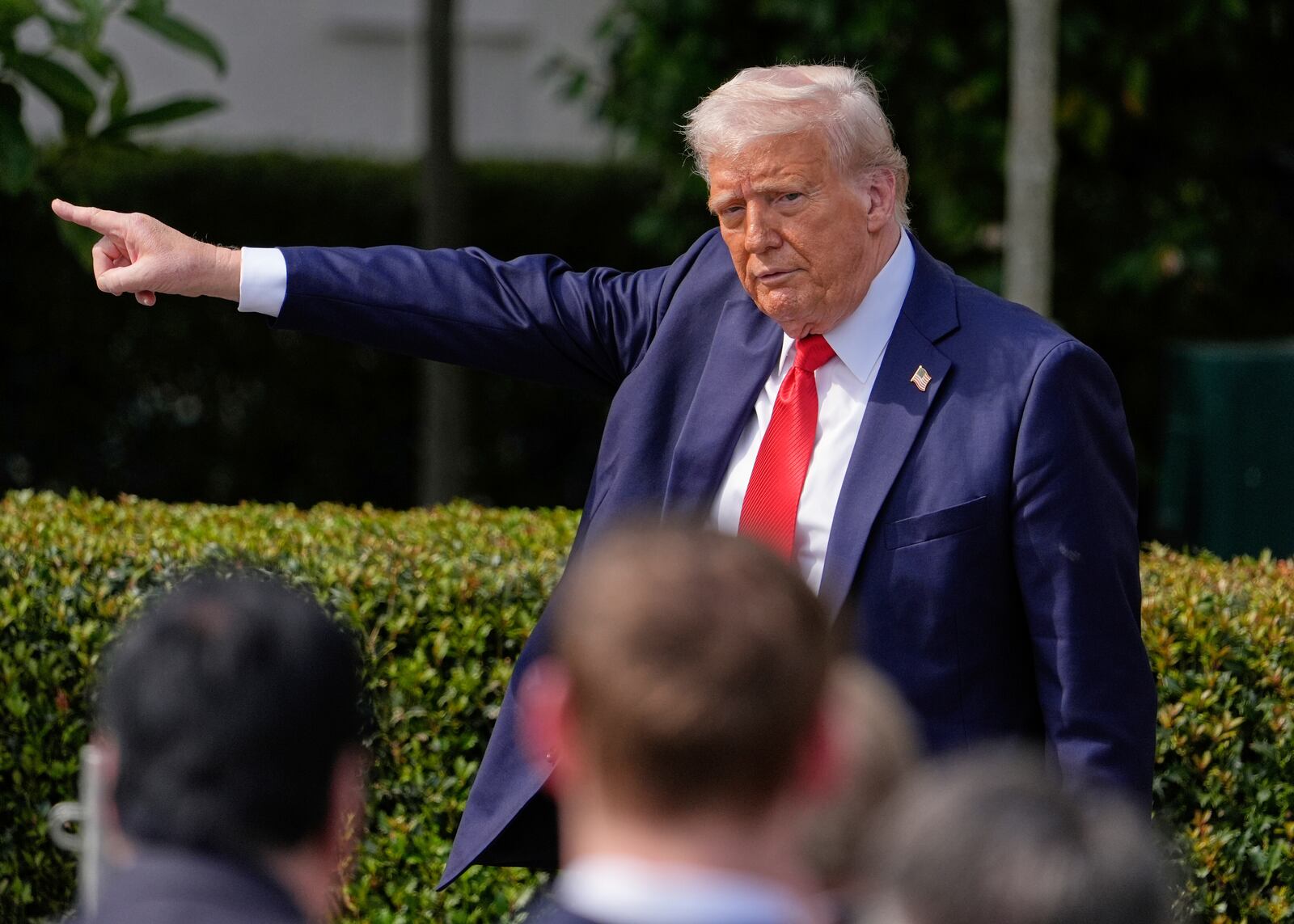 President Donald Trump gestures to the crowd as he departs after welcoming the 2025 College Football National Champions, the Ohio State University football team, during an event on the South Lawn of the White House, Monday, April 14, 2025, in Washington. (AP Photo/Manuel Balce Ceneta)