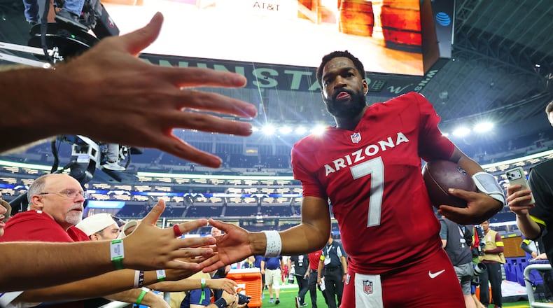 Arizona Cardinals' Jacoby Brissett (7) greets fans as he walks off the field following an NFL football game against the Dallas Cowboys Monday, Nov. 3, 2025, in Arlington, Texas. (AP Photo/Richard Rodriguez)