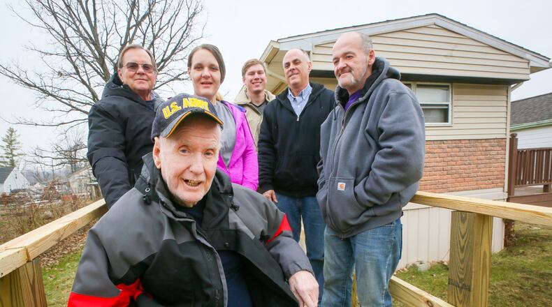 Army veteran Jessie Philpot was able to return home after being released from the hospital thanks to a new wheelchair ramp installed at his home with the help of SELF. With Philpot are his granddaughter and her boyfriend, and from SELF, John Post, Casey Taylor and Greg Sargent. GREG LYNCH / STAFF