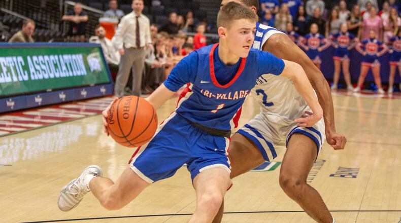 Tri-Village High School's Trey Sagester drives past a Cincinnati Summit Country Day defender during their game last season at UD Arena in Dayton.  Jeff Gilbert/CONTRIBUTED