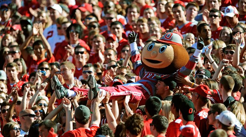 COLUMBUS, OH - SEPTEMBER 25:  Mascot Brutus Buckeye is carried up the stands by fans during a game against the Eastern Michigan Eagles at Ohio Stadium on September 25, 2010 in Columbus, Ohio.  (Photo by Jamie Sabau/Getty Images)
