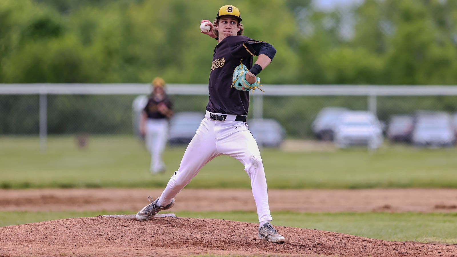 Shawnee High School senior Joey Ross delivers a pitch to the plate during their Division IV tournament game against Shawnee on Wednesday, May 21. The Braves won 4-1. MICHAEL COOPER / STAFF
