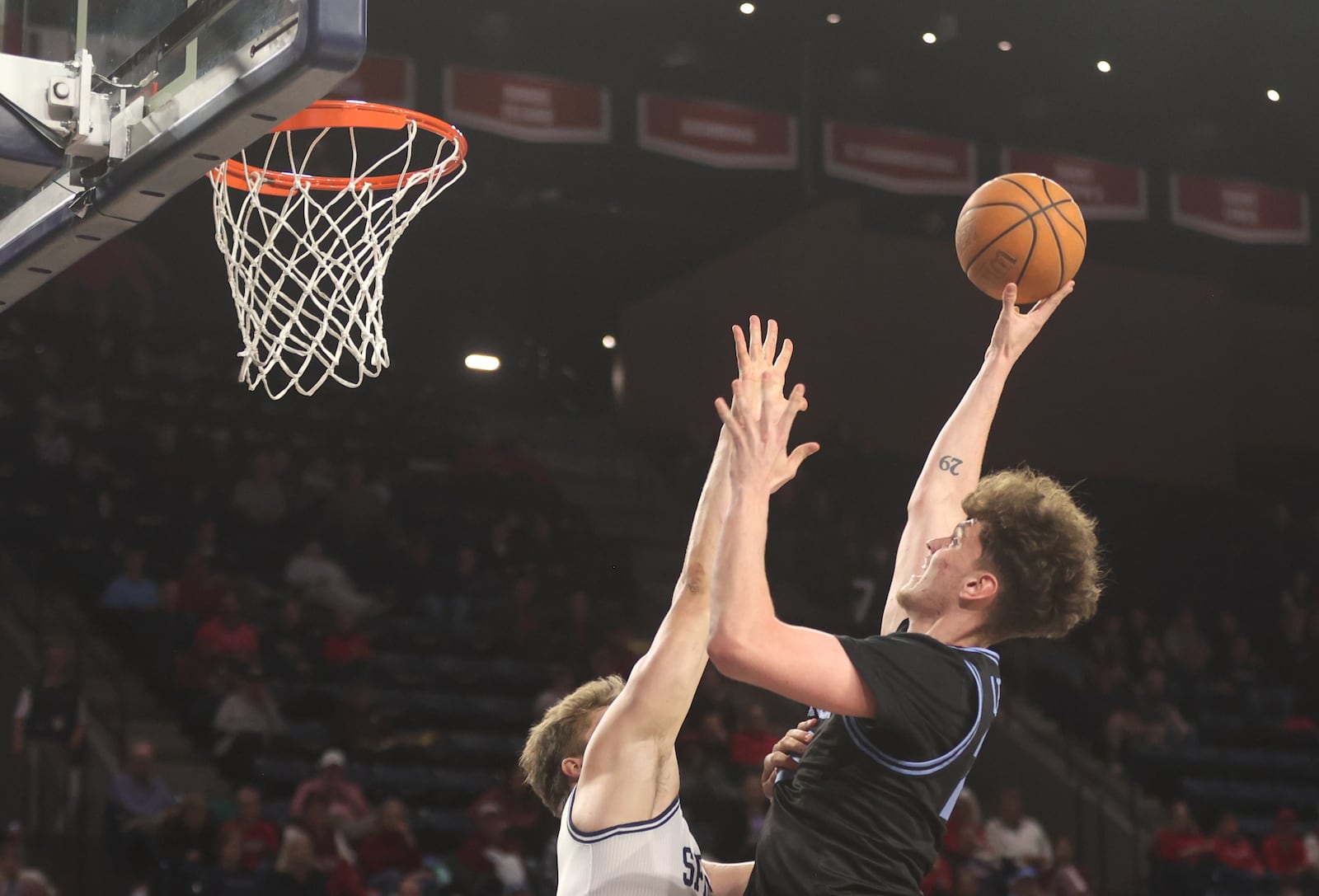 Dayton's Amaël L'Etang shoots against Richmond on Tuesday, March 3, 2026, at the Robins Center in Richmond, Va. David Jablonski/Staff