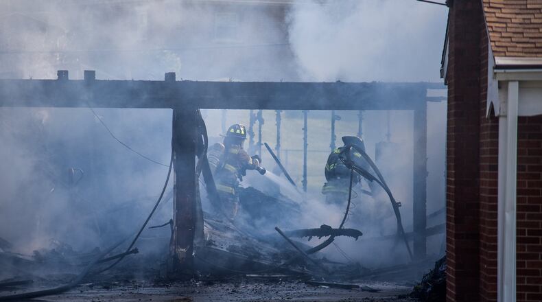 Ohio Rep. George Lang, R-West Chester Twp., introduced a new bill that would fund workers compensation claims by first responders with a PTSD injury that doesn’t accompany a physical industry outside of the Bureau of Workers’ Compensation. It’s an alternative bill that passed he Ohio House last month by way of a 74-22 vote. The Ohio Senate is now debating that bill. Pictured are Middletown firefighters working to extinguish a garage fire in July 2019. NICK GRAHAM/FILE