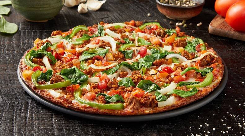 Donatos Cauliflower Bruschetta Pizza, one of three new signature pizzas from the Columbus-based Donatos chain that features a cauliflower crust and plant-based sausage.
