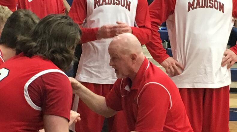 Madison coach Jeff Smith talks to his team during Friday night’s Division II sectional game against Clinton-Massie at Fairmont’s Trent Arena. RICK CASSANO/STAFF