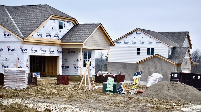 Houses are under construction by M/I Homes in the Arbor Park subdivision in Liberty Township. NICK GRAHAM / STAFF