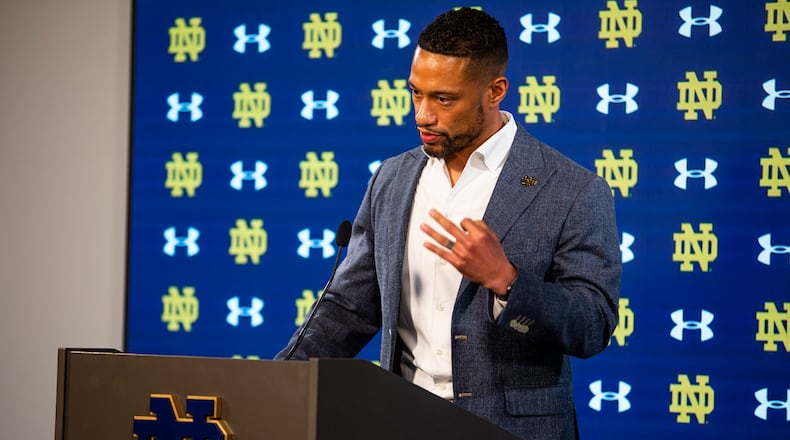 Notre Dame head football coach Marcus Freeman speaks during a media availability Wednesday, Feb. 16, 2022 at Notre Dame Stadium in South Bend, Ind. Of all the new responsibilities Marcus Freeman now has as the new coach at Notre Dame, hiring assistant coaches might have been the most challenging so far. The 10-person staff was officially completed with the announcement of the hiring of Al Golden as defensive coordinator. (Michael Caterina/South Bend Tribune via AP)