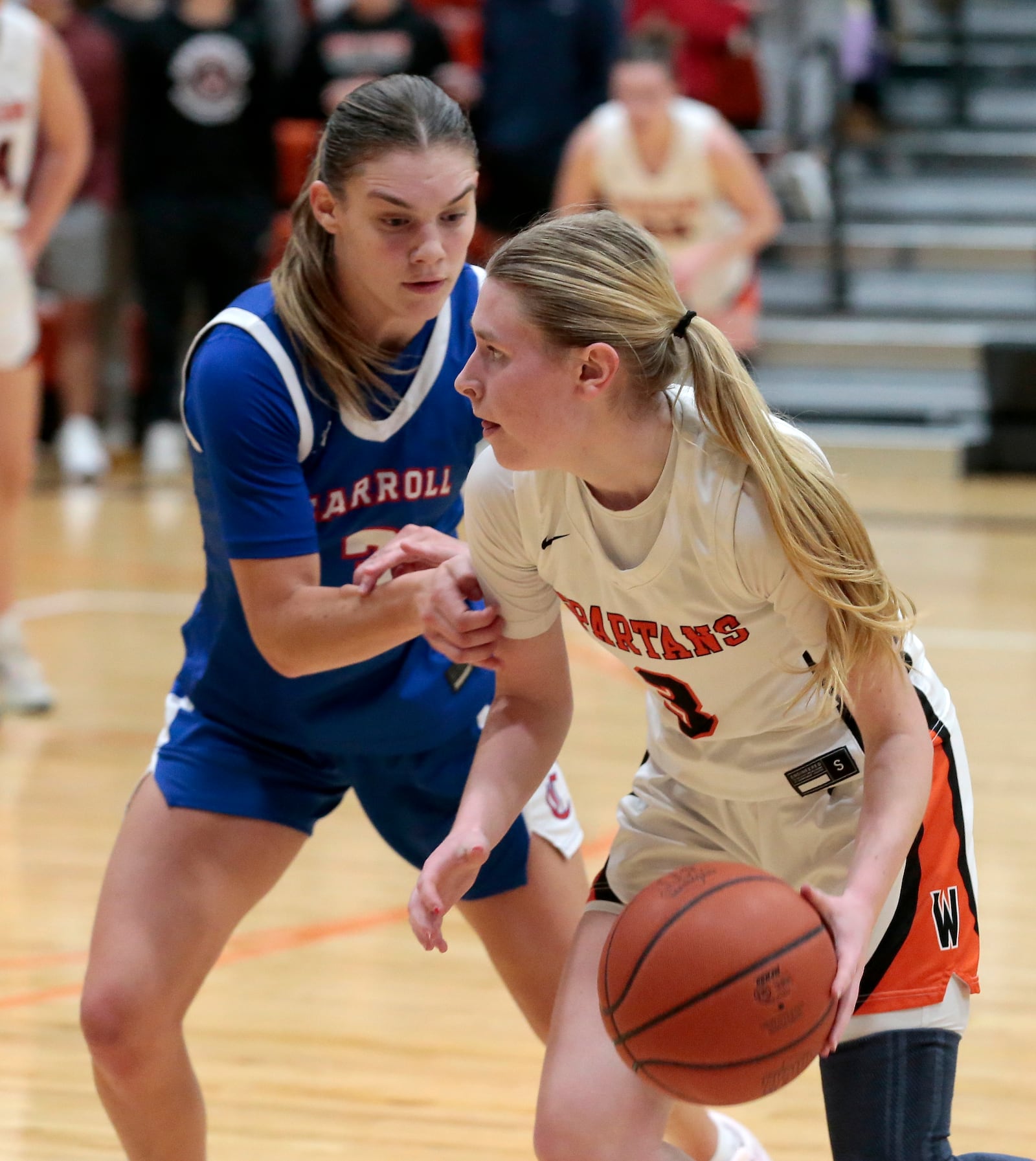 Waynesville senior Katie Berrey is guarded by Carroll senior Eva Snyder. Carroll defeated Waynesville 50-42 in a non-league game on Monday, Jan. 5, 2026, at Waynesville. STEVEN WRIGHT / STAFF