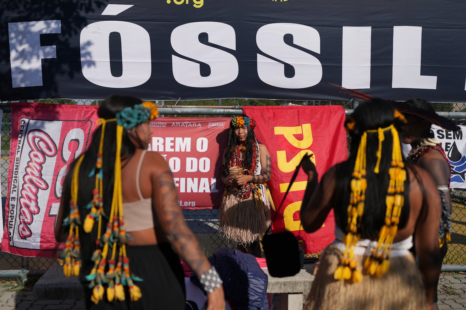 Indigenous women attend a protest against the auction of dozens of oil blocks, including blocks near the mouth of the Amazon River, in Rio de Janeiro, Tuesday, June 17, 2025. (AP Photo/Silvia Izquierdo