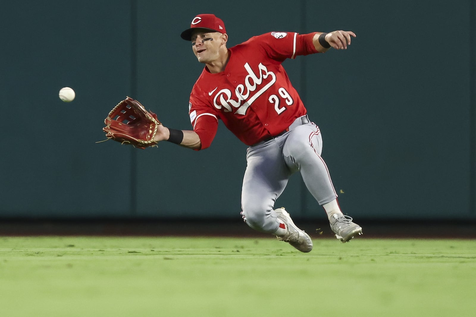 Cincinnati Reds center fielder TJ Friedl (29) makes a catch during the fourth inning of a baseball game against the Los Angeles Angels, Monday, Aug. 18, 2025, in Anaheim, Calif. (AP Photo/Jessie Alcheh)