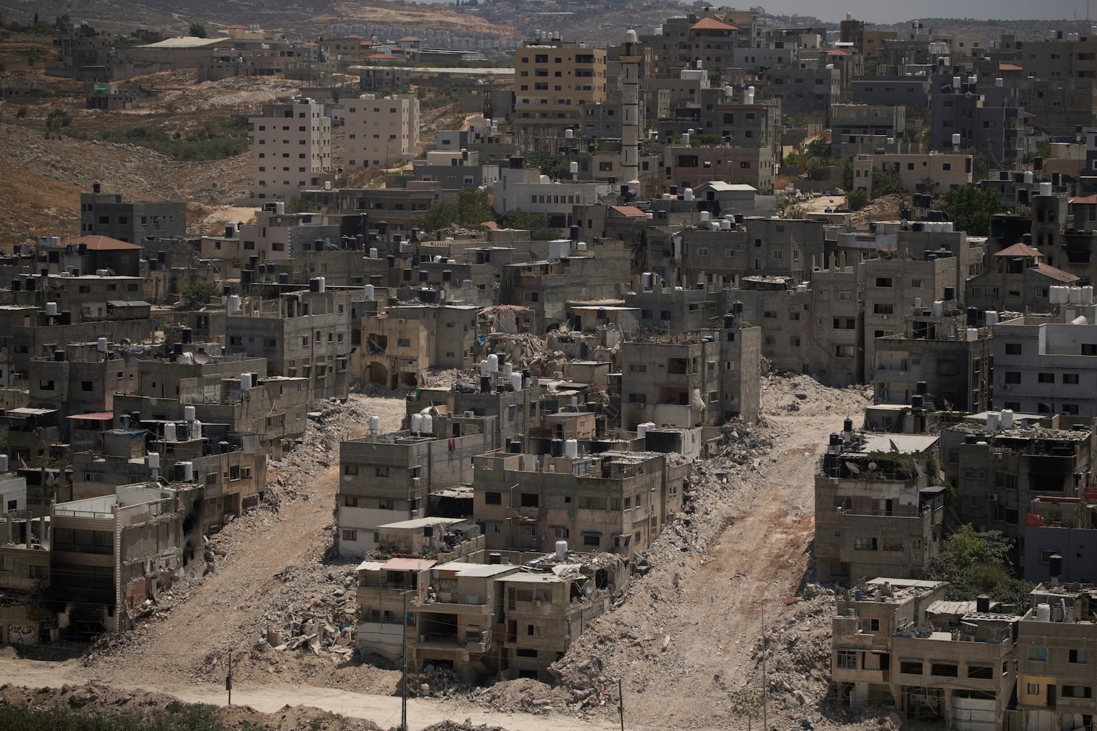 Destroyed houses during the Israeli forces ground operations are seen at the Nur Shams refugee camp, in the West Bank city of Tulkarem, Wednesday, July 2, 2025. (AP Photo/Leo Correa)