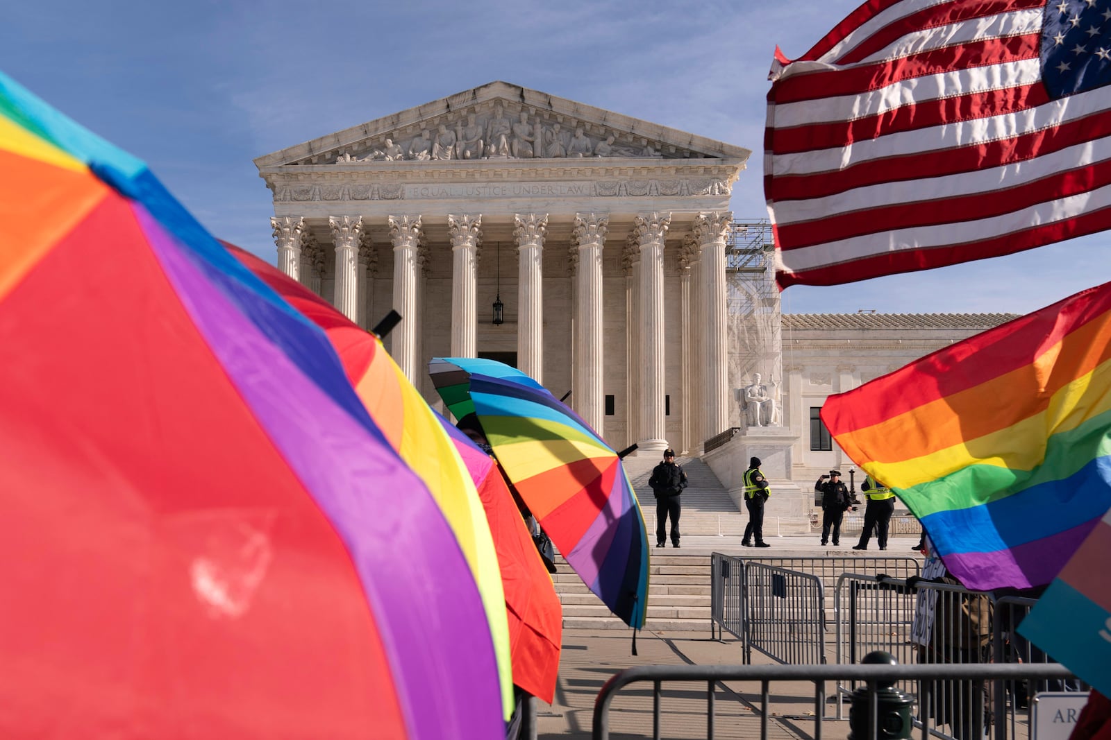 FILE - Transgenders rights supporters rally outside of the Supreme Court, Dec. 4, 2024, in Washington. (AP Photo/Jose Luis Magana, File)