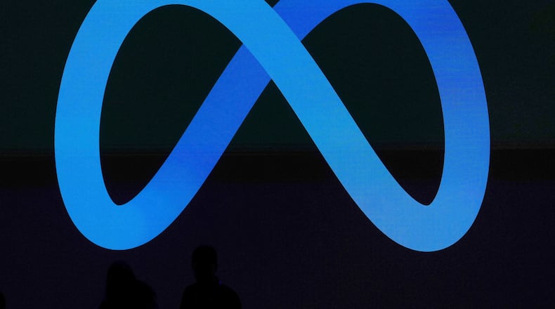 FILE -A Meta logo is shown on a video screen at LlamaCon 2025, an AI developer conference, in Menlo Park, Calif., April 29, 2025. (AP Photo/Jeff Chiu, File)