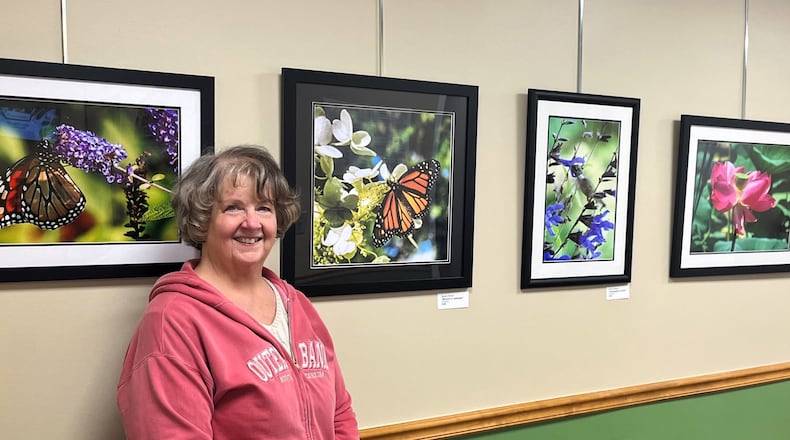 The Middletown Arts Center (MAC), in collaboration with Butler Behavioral Health (BBH), will launch a satellite art exhibition that features the work of Bev Brewer Stolzenberger. Pictured is Bev at the exhibit installation. CONTRIBUTED