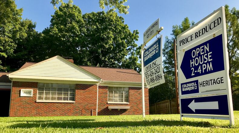 A sign outside a home at 3607 Poinciana Road in Middletown advertises for an open house earlier this year. Home sales through and including November are up nearly 1 percent in Butler County compared to the same time last year and the average price is up 5.7 percent. NICK GRAHAM/STAFF