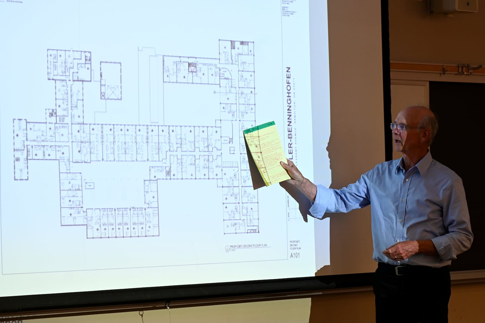 Ken Schon, a principle at developer Bloomfield/Schon, presents the $29 million development plan of the Shuler Benninghoffen redevelopment project on Monday, April 21, 2025, at Miami University Regionals in Hamilton that would turn the former woolen mill in Lindenwald into a mixed-use development that features 127 apartments, 150 open lot parking spaces, and commercial space. MICHAEL D. PITMAN/STAFF