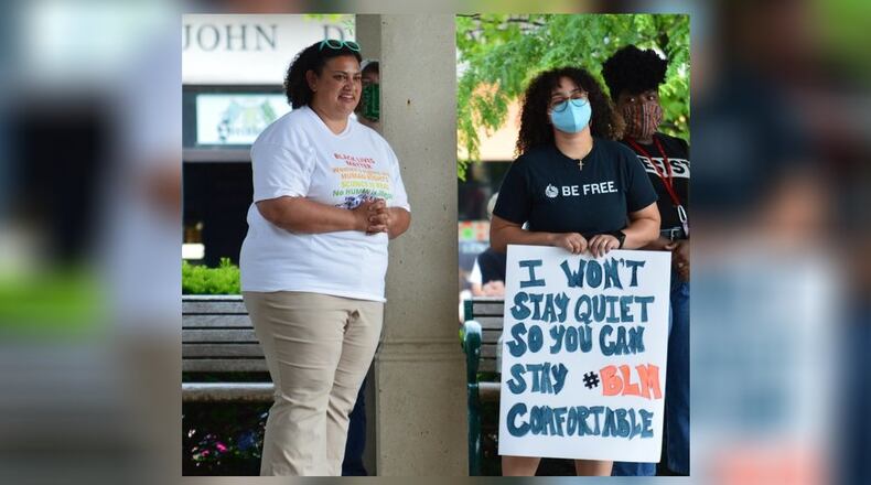 Tricia Hillman (left) organized the vigil held Uptown on Monday evening. CONTRIBUTED/BOB RATTERMAN
