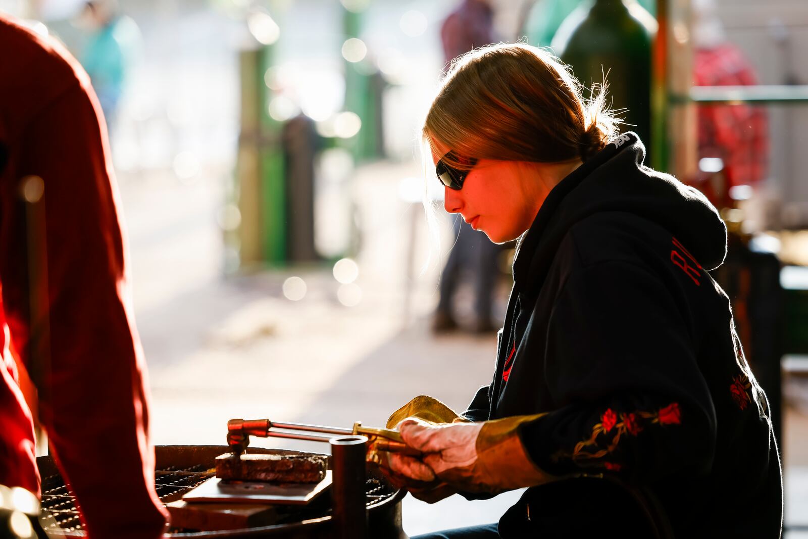 Victoria Bennett, 16, from Edgewood, cuts metal with a torch for a project in the welding program at Butler Tech Wednesday, Oct. 18, 2023 in Fairfield Township. NICK GRAHAM/STAFF