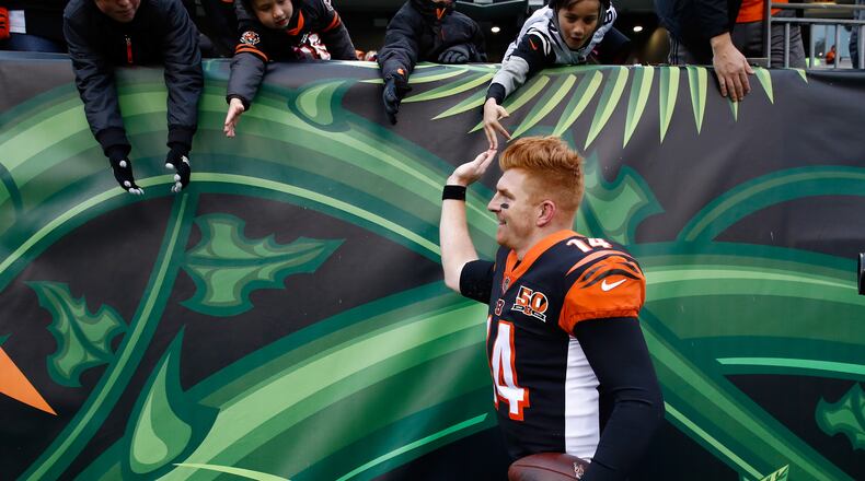 CINCINNATI, OH - OCTOBER 29: Andy Dalton #14 of the Cincinnati Bengals celebrates with fans after the Bengals 24-23 win over the Indianapolis Colts at Paul Brown Stadium on October 29, 2017 in Cincinnati, Ohio. (Photo by Andy Lyons/Getty Images)