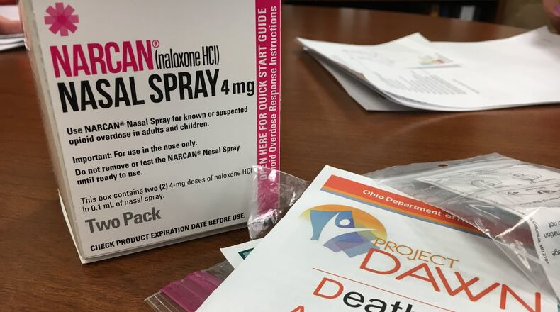 Each naloxone kit distributed by Project DAWN includes a nasal spray device with two doses of 2 mg each of the overdose-reversing drug. Wider distribution of naloxone is one of the proposed solutions presented to state officials Monday at a meeting with media representatives from the organization Your Voice Ohio. KATIE WEDELL/STAFF
