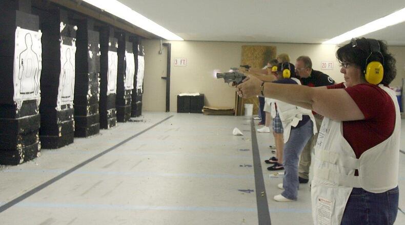 Despite often having a police presence at meetings, some Butler County elected officials say they would be in favor of a law that permits CCW holders to carry in government buildings. STAFF FILE PHOTO