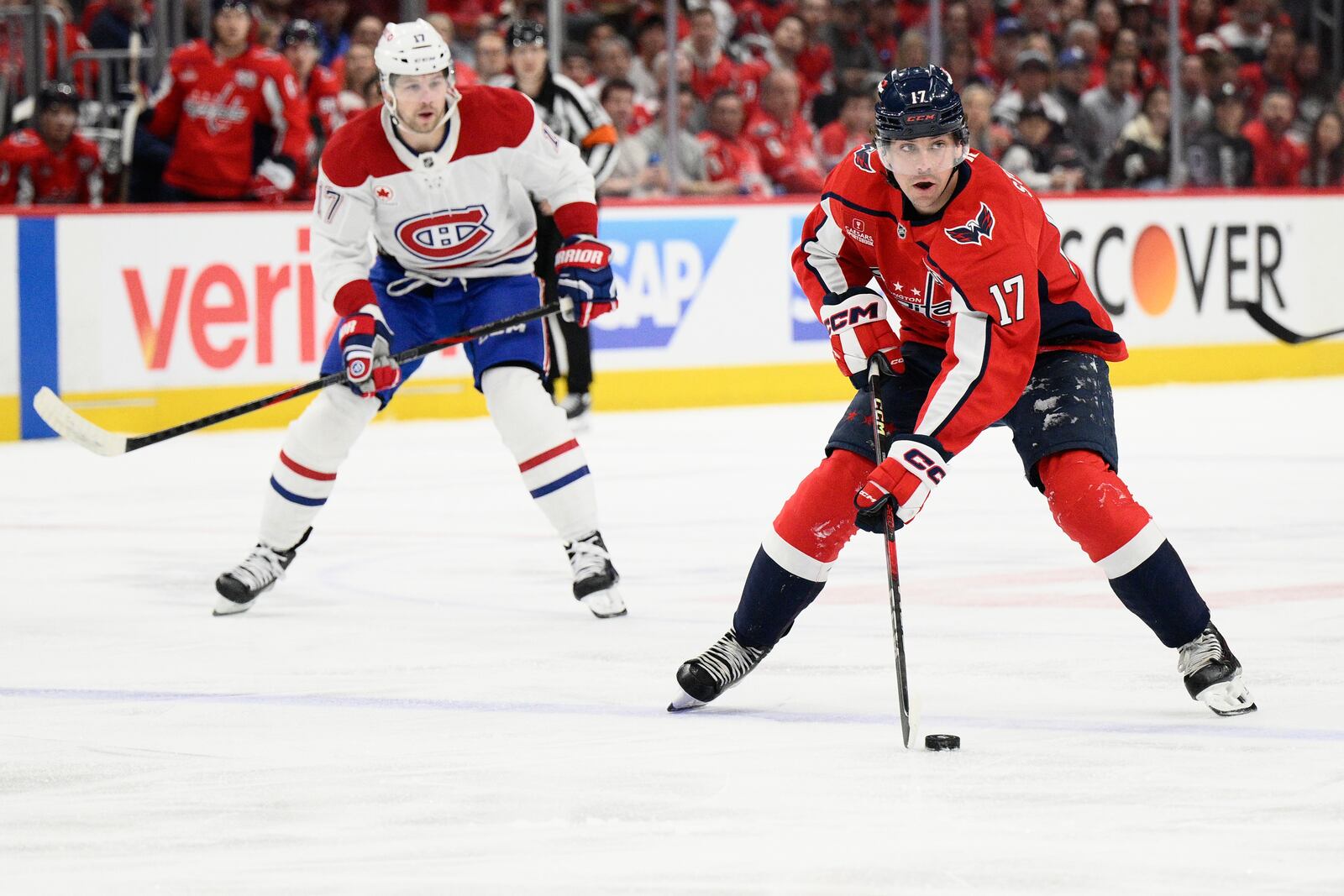 Washington Capitals center Dylan Strome, front, skates with the puck past Montreal Canadiens right wing Josh Anderson, back, in the first period of Game 2 of a first-round NHL hockey playoff series Wednesday, April 23, 2025, in Washington. (AP Photo/Nick Wass)