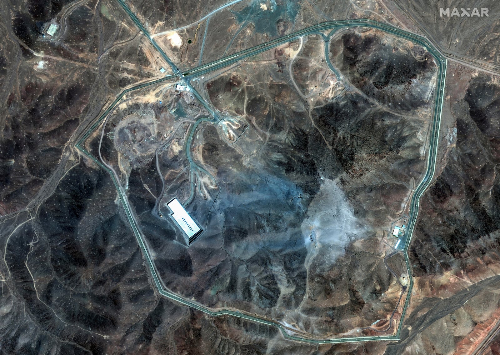 This satellite image provided by Maxar Technologies shows damage at the Fordo enrichment facility in Iran after U.S. strikes, Sunday, June 22, 2025. (Maxar Technologies via AP)