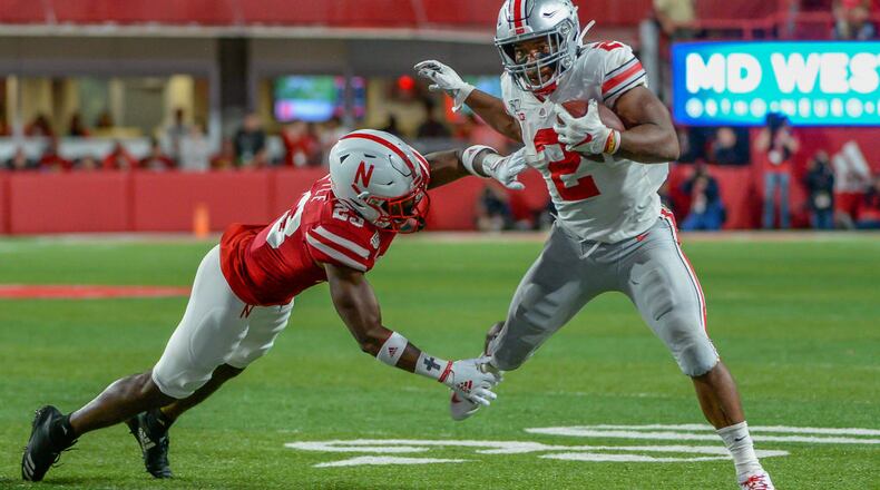 LINCOLN, NE - SEPTEMBER 28: Running back J.K. Dobbins #2 of the Ohio State Buckeyes escapes the tackle of cornerback Dicaprio Bootle #23 of the Nebraska Cornhuskers at Memorial Stadium on September 28, 2019 in Lincoln, Nebraska. (Photo by Steven Branscombe/Getty Images)