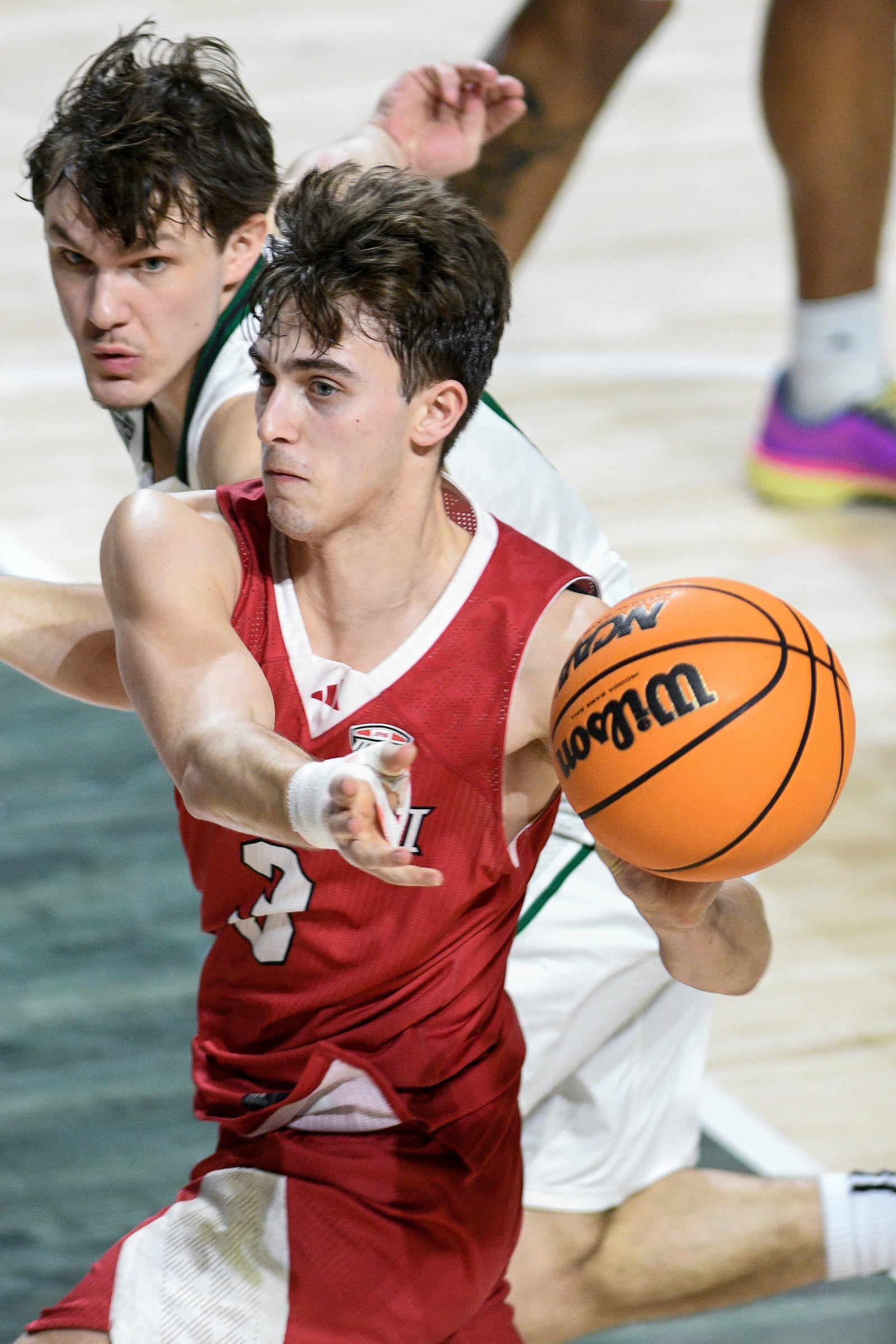 Miami (Ohio) guard Luke Skaljac catches a pass during the second half of an NCAA college basketball game against Ohio, Friday, March 6, 2026, in Athens, Ohio. (AP Photo/HG Biggs)