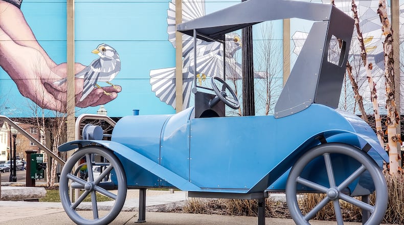 A sculpture in honor of The Republic Motor Car company is parked in Rotary Park at the corner of N. 2nd street and High Street in Hamilton. The metal sculpture was dedicated in 2015 by The Antique and Classic Car Club of Butler County. The Republic Motor Car Company made cars in Hamilton in the early 1900s. NICK GRAHAM/STAFF