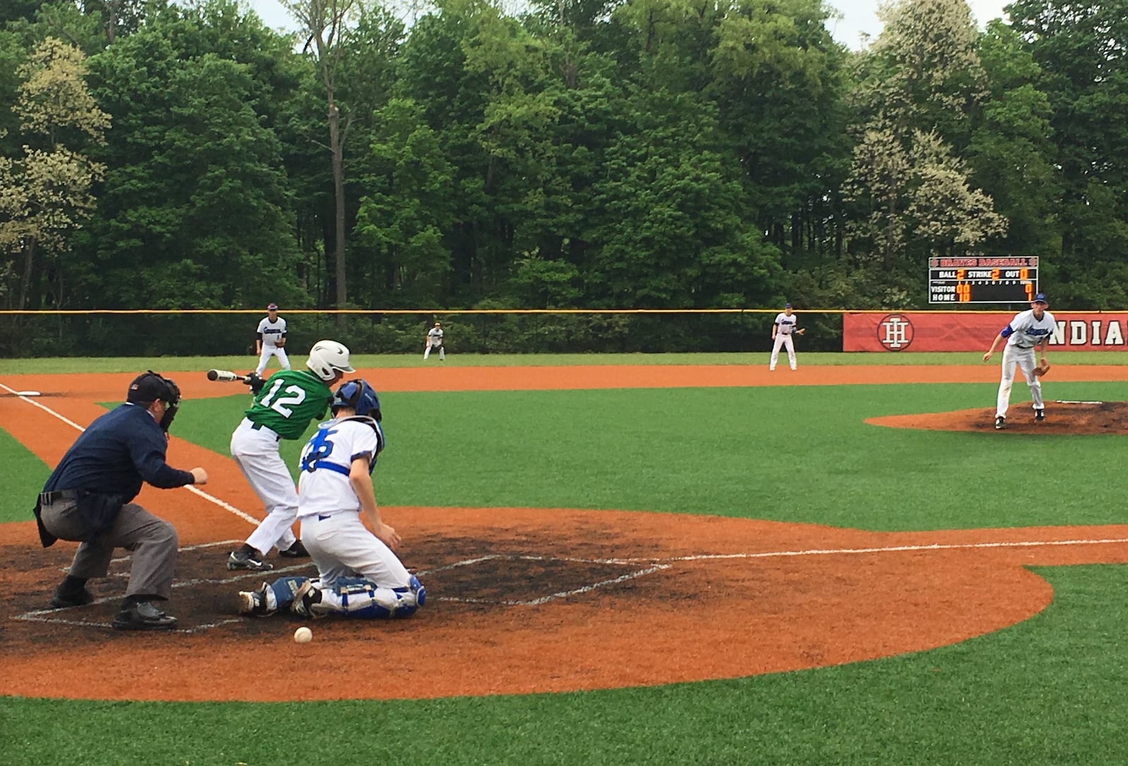 New Miami’s Donovan Howard strikes out on a pitch from Cincinnati Christian’s Mitchell Smith, but the ball gets past CCS catcher Cody Anderson and Howard made it to first base during Thursday’s Division IV district semifinal at Indian Hill. RICK CASSANO/STAFF
